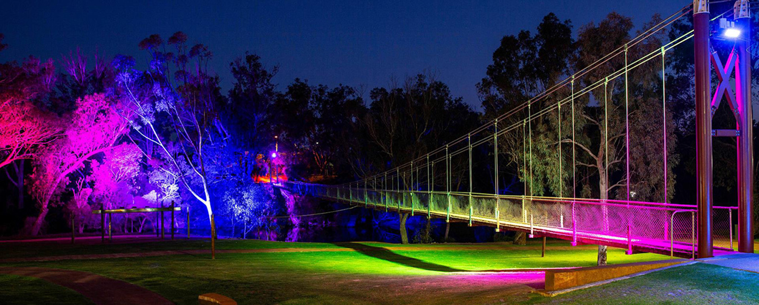 Architectural lighting illuminating the Murray River Foreshore Works pedestrian bridge and surrounding landscape