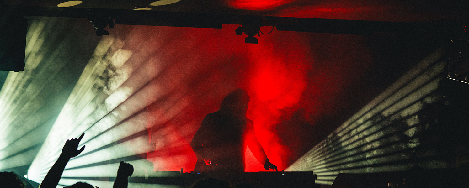 Entertainment lighting illuminating a live concert stage
