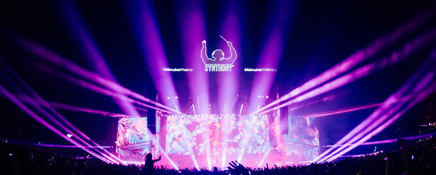 Entertainment lighting illuminating a live concert stage